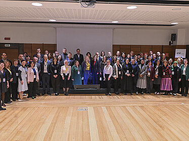 Several people pose for a group photo