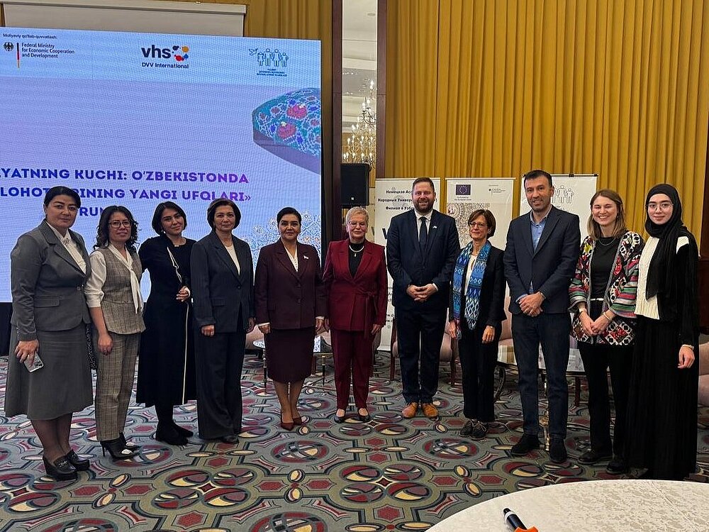 Several people pose for a group photo.