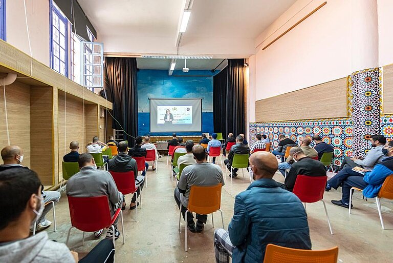 Inmates at the central prison of Kenitra attending a course being broadcast from the studio of the prison of Salé