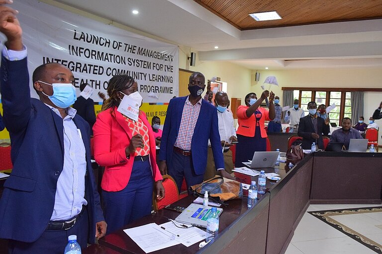 Participants celebrating the launch of IMIS. DVV International Uganda