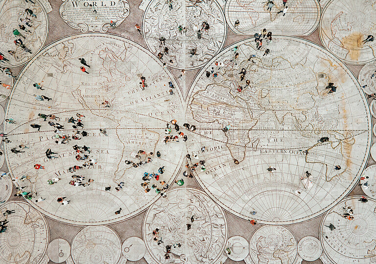 People walking on the world map, BILDUNG project, DVV International