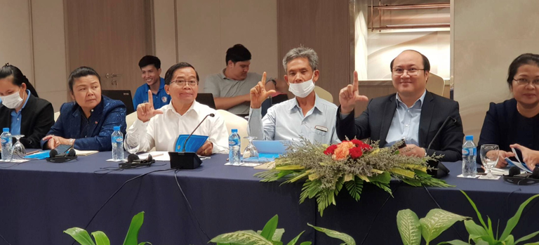 Three man making the sign of an L with their finergs, lifelong learning